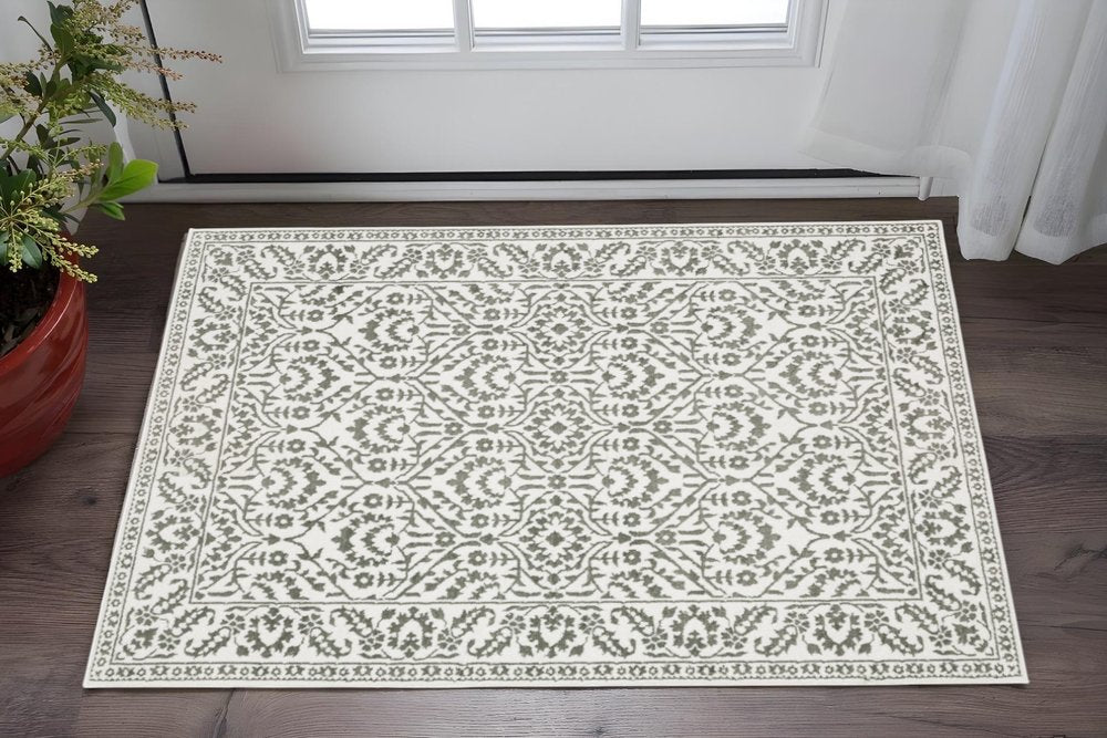 5' X 8' Grey And White Floral Power Loom Stain Resistant Area Rug