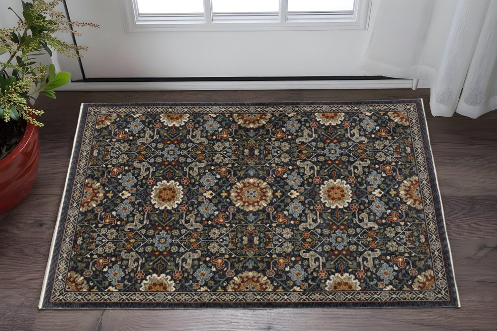 10' X 13' Blue Red Ivory And Gold Oriental Power Loom Stain Resistant Area Rug With Fringe