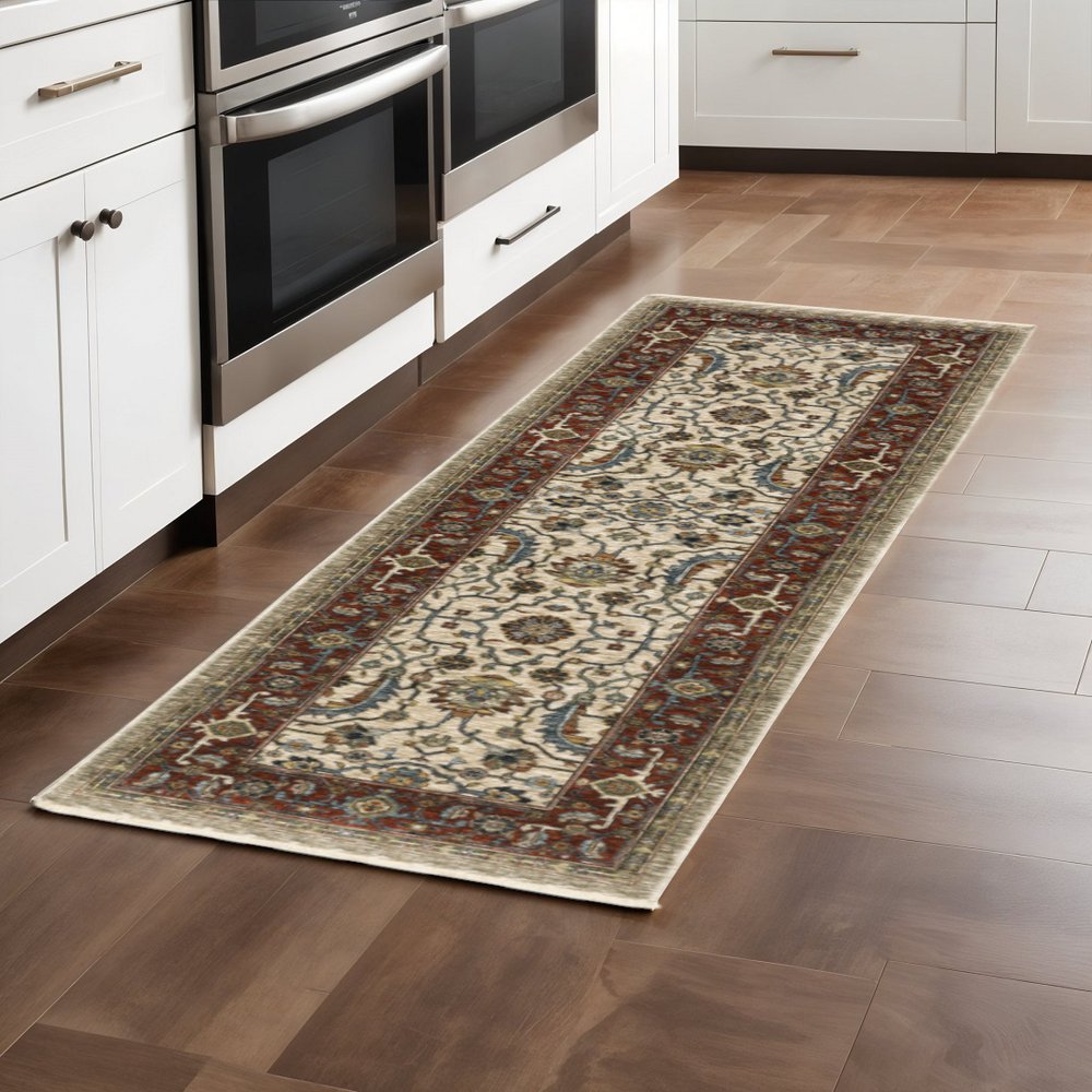 2' X 3' Ivory Red Green Grey Blue And Navy Oriental Power Loom Stain Resistant Area Rug With Fringe