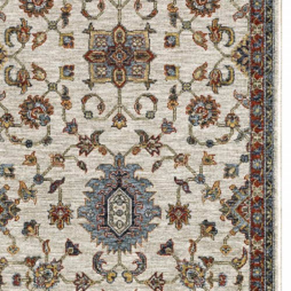 5' X 8' Beige Rust Red Blue Gold And Grey Oriental Power Loom Stain Resistant Area Rug With Fringe