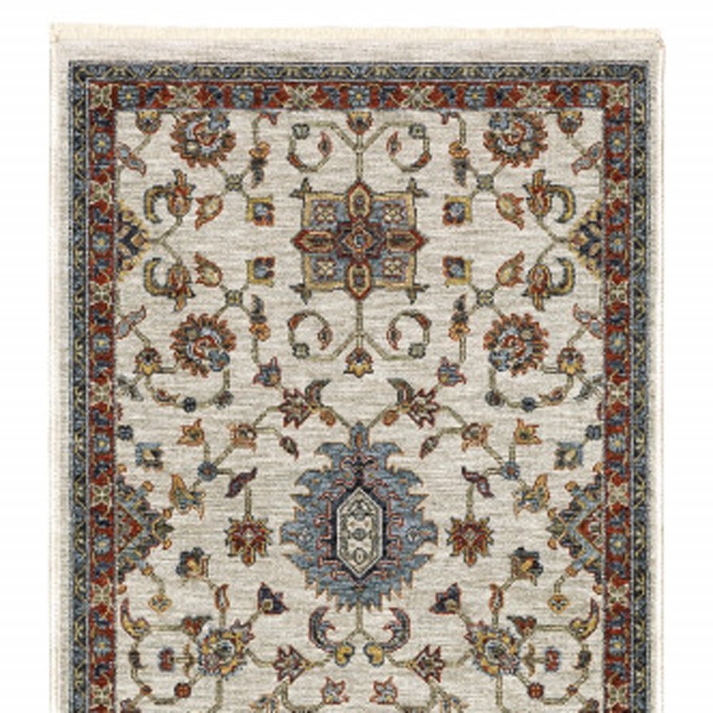 5' X 8' Beige Rust Red Blue Gold And Grey Oriental Power Loom Stain Resistant Area Rug With Fringe
