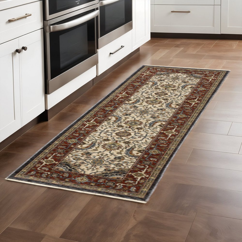 3' X 5' Ivory Beige Red Blue Gold Green And Navy Oriental Power Loom Stain Resistant Area Rug With Fringe