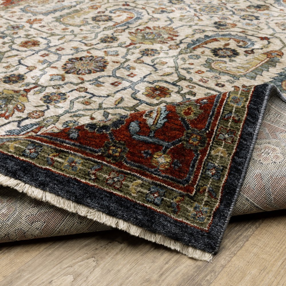 3' X 5' Ivory Beige Red Blue Gold Green And Navy Oriental Power Loom Stain Resistant Area Rug With Fringe