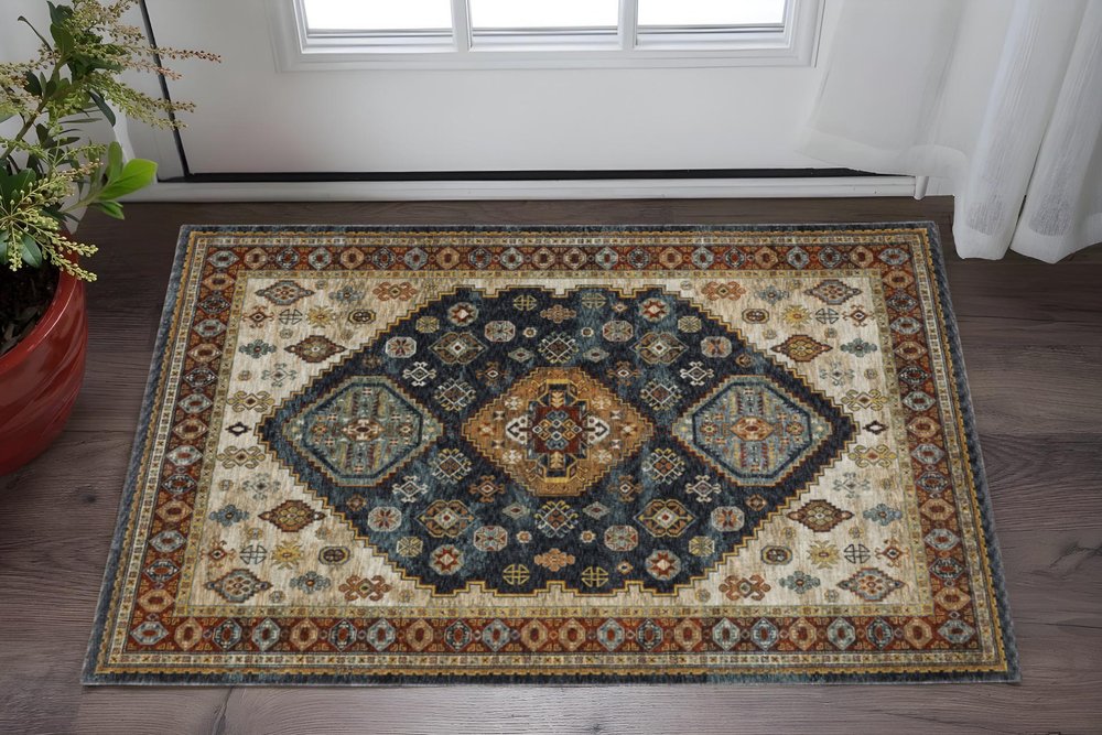 5' X 8' Blue Red Beige Orange Gold And Tan Oriental Power Loom Stain Resistant Area Rug With Fringe