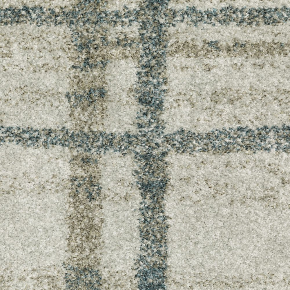 7' X 10' Grey Teal Beige and Tan Geometric Power Loom Area Rug