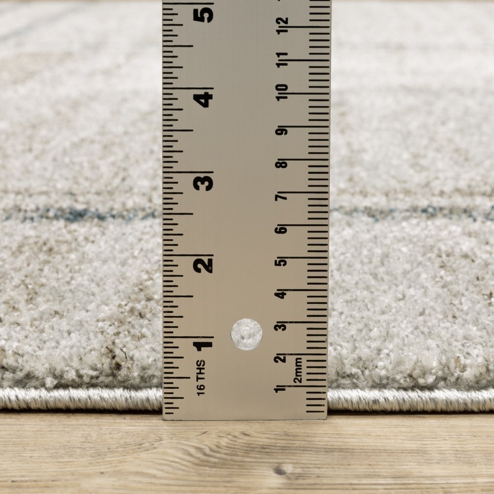 7' X 10' Grey Teal Beige and Tan Geometric Power Loom Area Rug