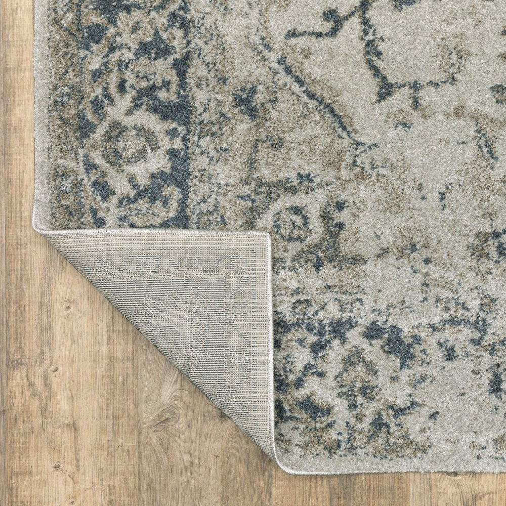 5' X 8' Beige And Blue Oriental Distressed Area Rug