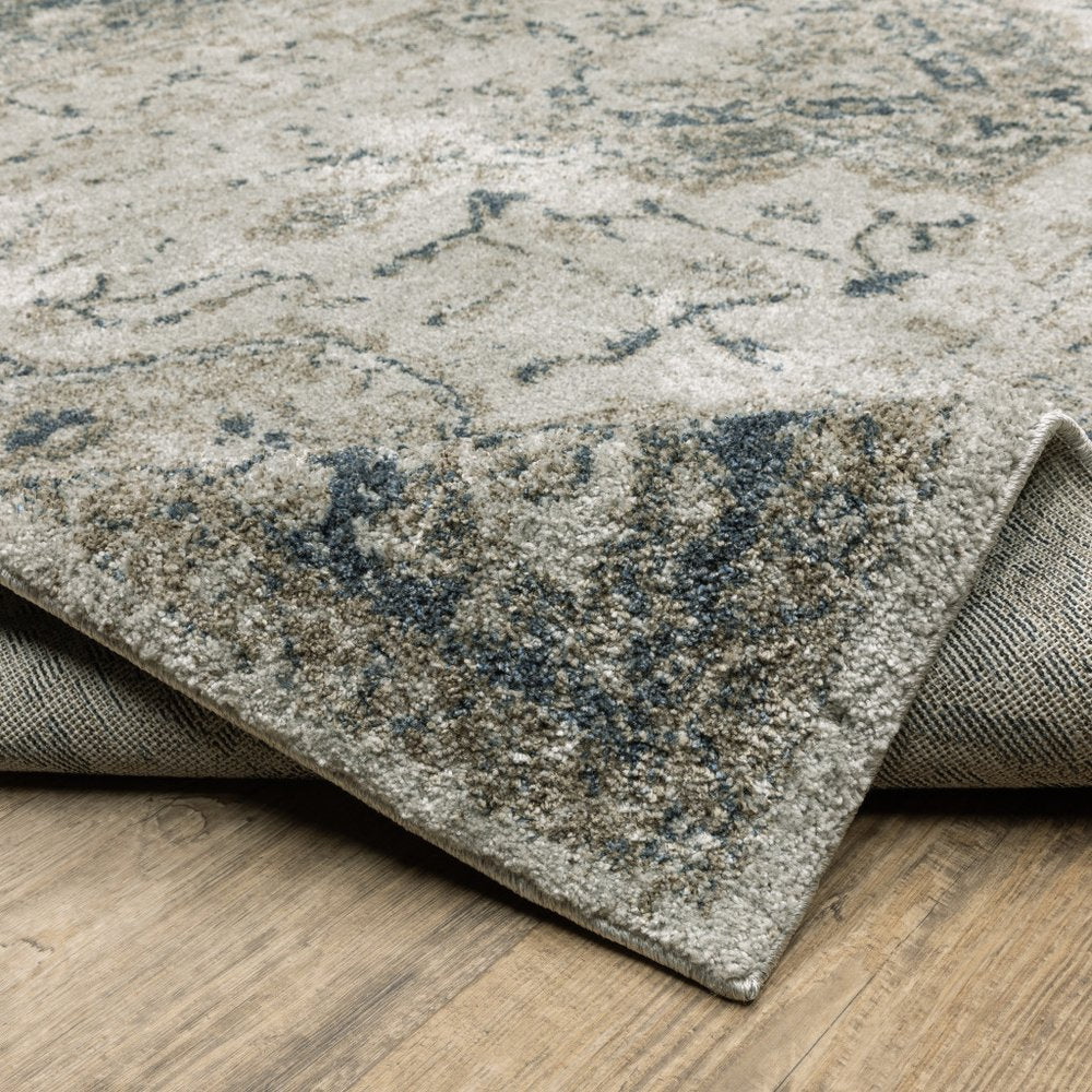 5' X 8' Beige And Blue Oriental Distressed Area Rug