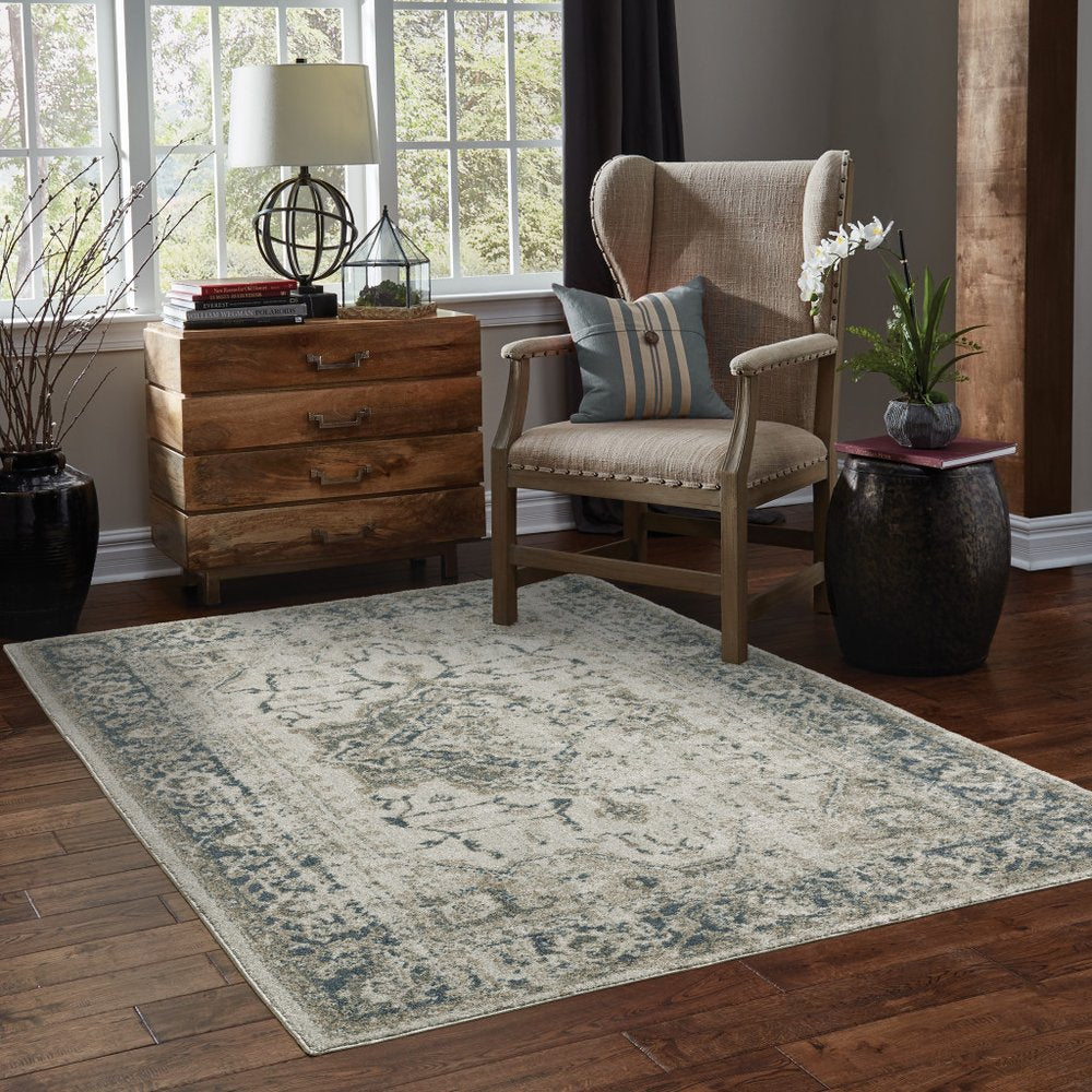 5' X 8' Beige And Blue Oriental Distressed Area Rug