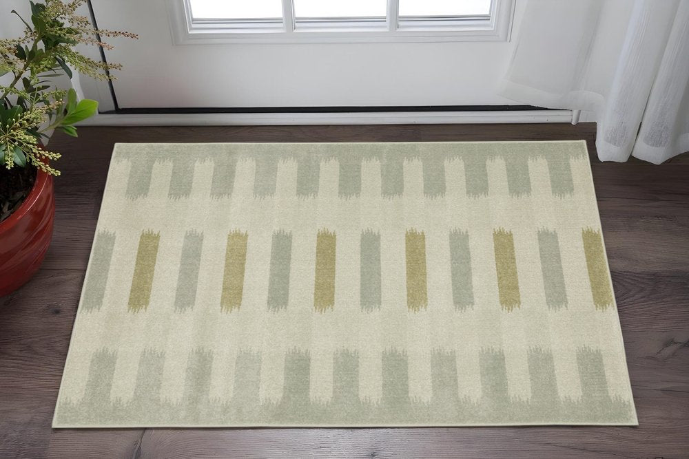 5' X 7' Beige Grey Gold And Green Geometric Power Loom Stain Resistant Area Rug