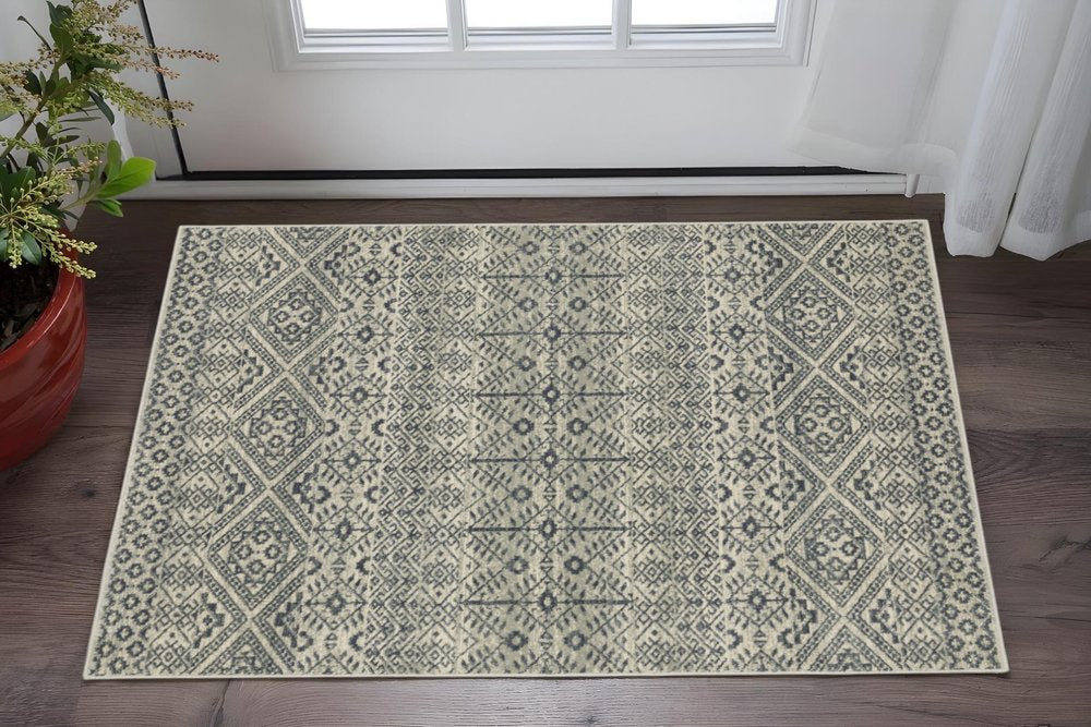 5' X 7' Blue And Beige Geometric Power Loom Stain Resistant Area Rug