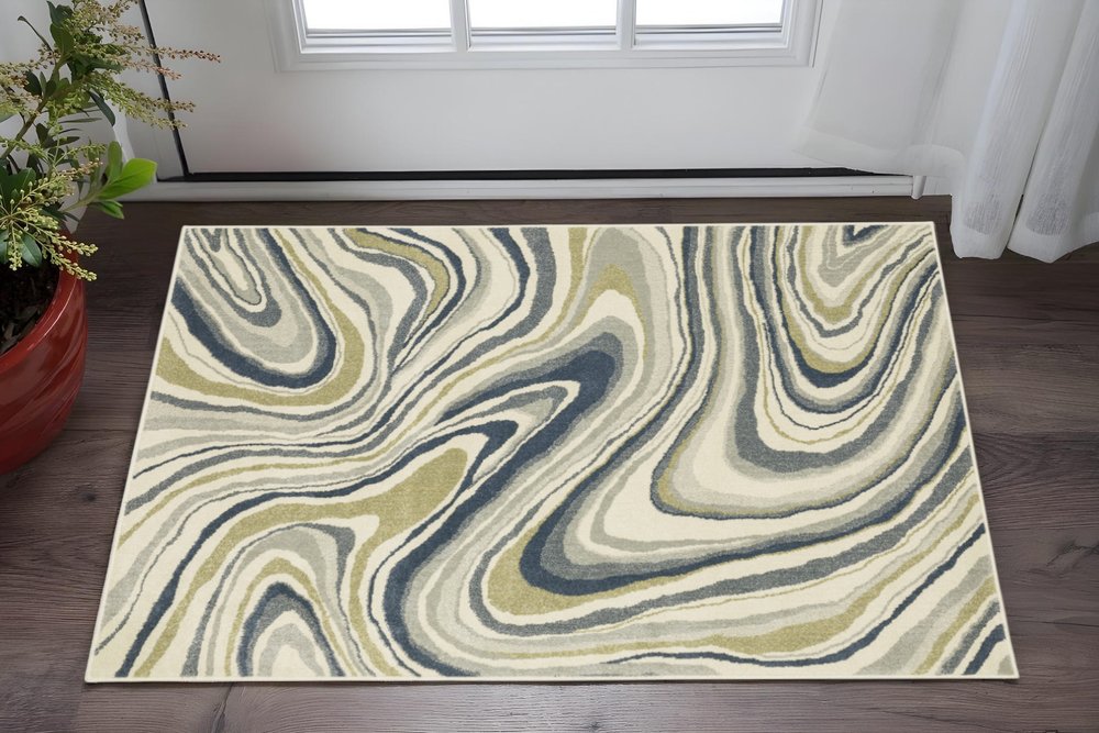 7' X 9' Ivory And Blue Abstract Area Rug