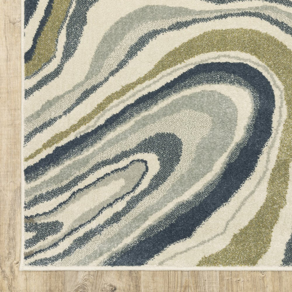 7' X 9' Ivory And Blue Abstract Area Rug