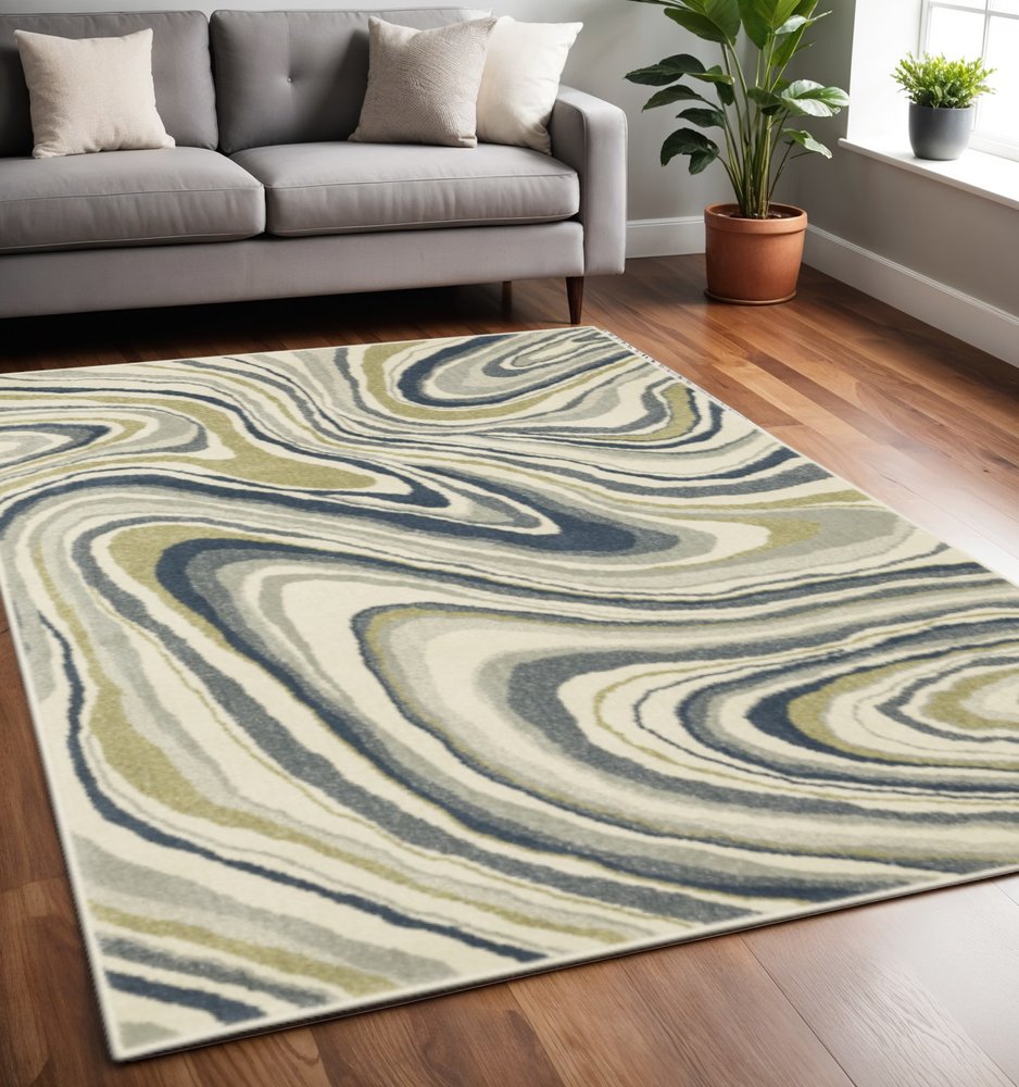 7' X 9' Ivory And Blue Abstract Area Rug