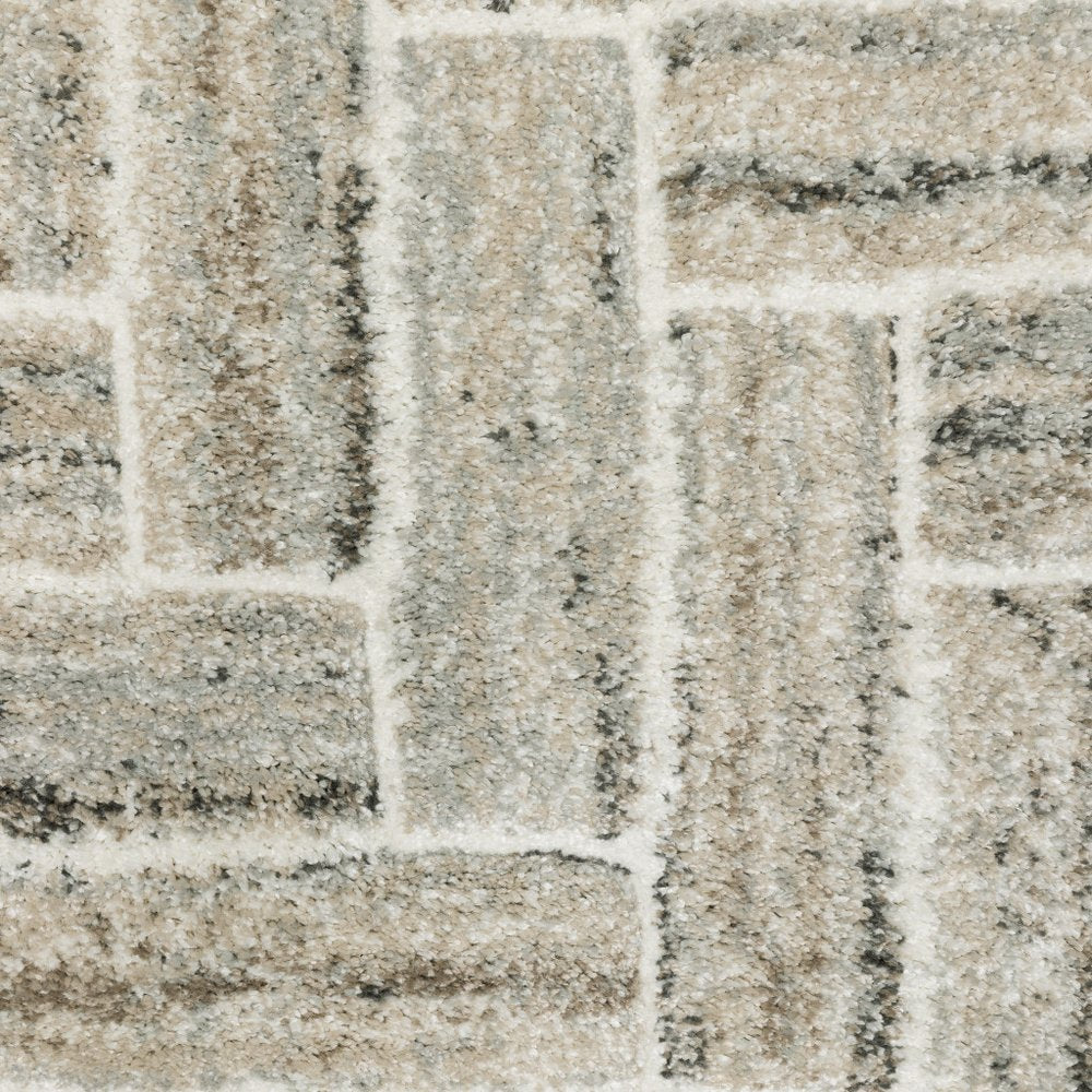 5' X 8' Ivory Beige Grey Brown Pale Blue And Charcoal Geometric Power Loom Stain Resistant Area Rug