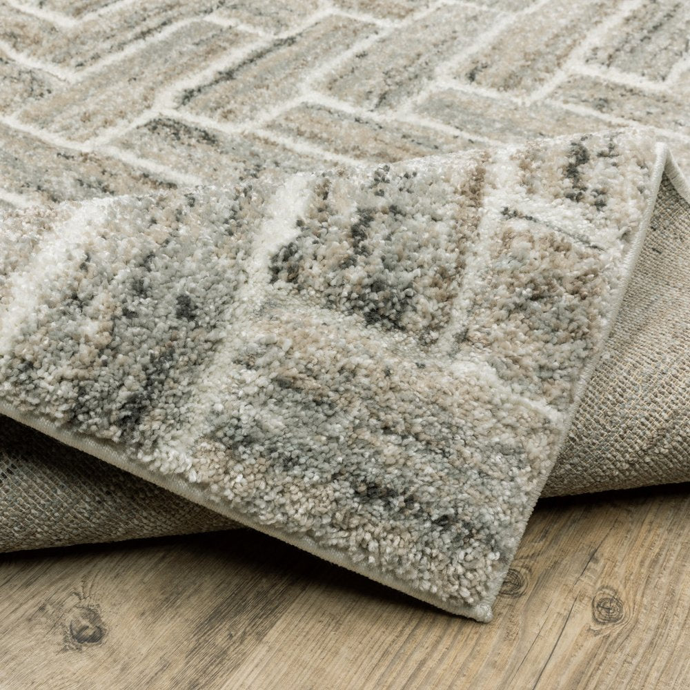 5' X 8' Ivory Beige Grey Brown Pale Blue And Charcoal Geometric Power Loom Stain Resistant Area Rug