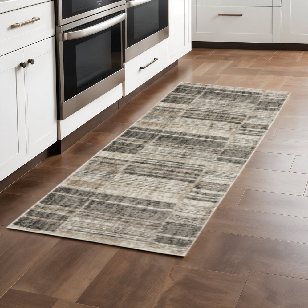 6' X 9' Grey Charcoal Ivory Tan Brown And Beige Geometric Power Loom Stain Resistant Area Rug