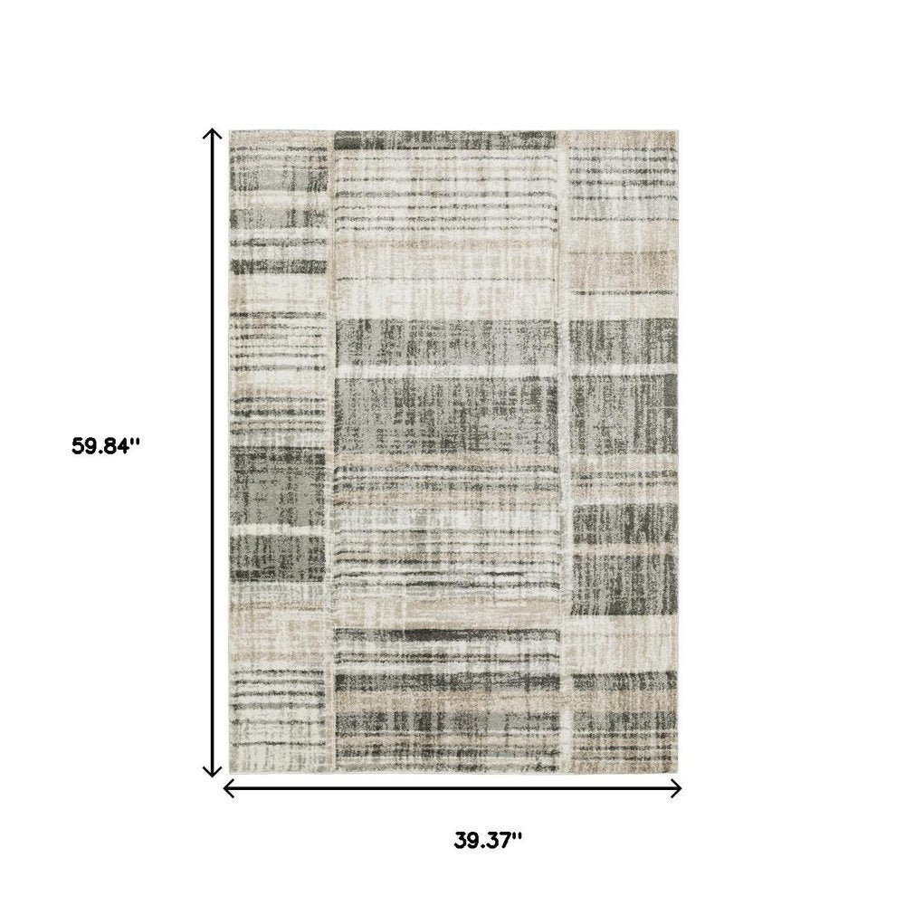 6' X 9' Grey Charcoal Ivory Tan Brown And Beige Geometric Power Loom Stain Resistant Area Rug