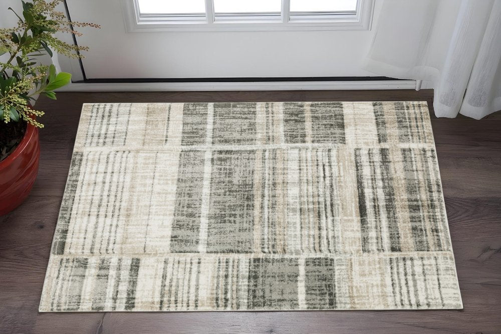 6' X 9' Grey Charcoal Ivory Tan Brown And Beige Geometric Power Loom Stain Resistant Area Rug