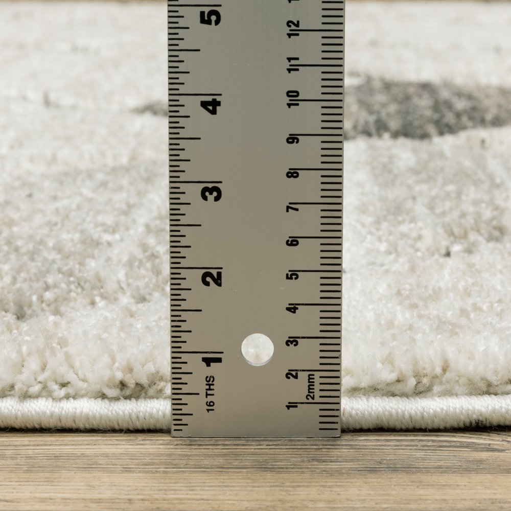 8' X 11' Beige And Gray Geometric Area Rug