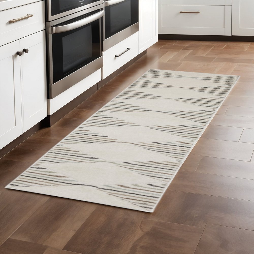 6' X 9' Beige Grey Sage Green Pale Blue Brown And Charcoal Geometric Power Loom Stain Resistant Area Rug