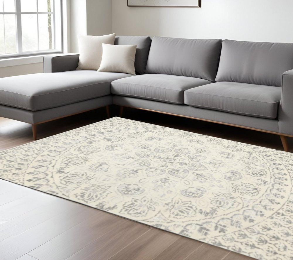 10' X 13' Ivory And Grey Floral Power Loom Stain Resistant Area Rug