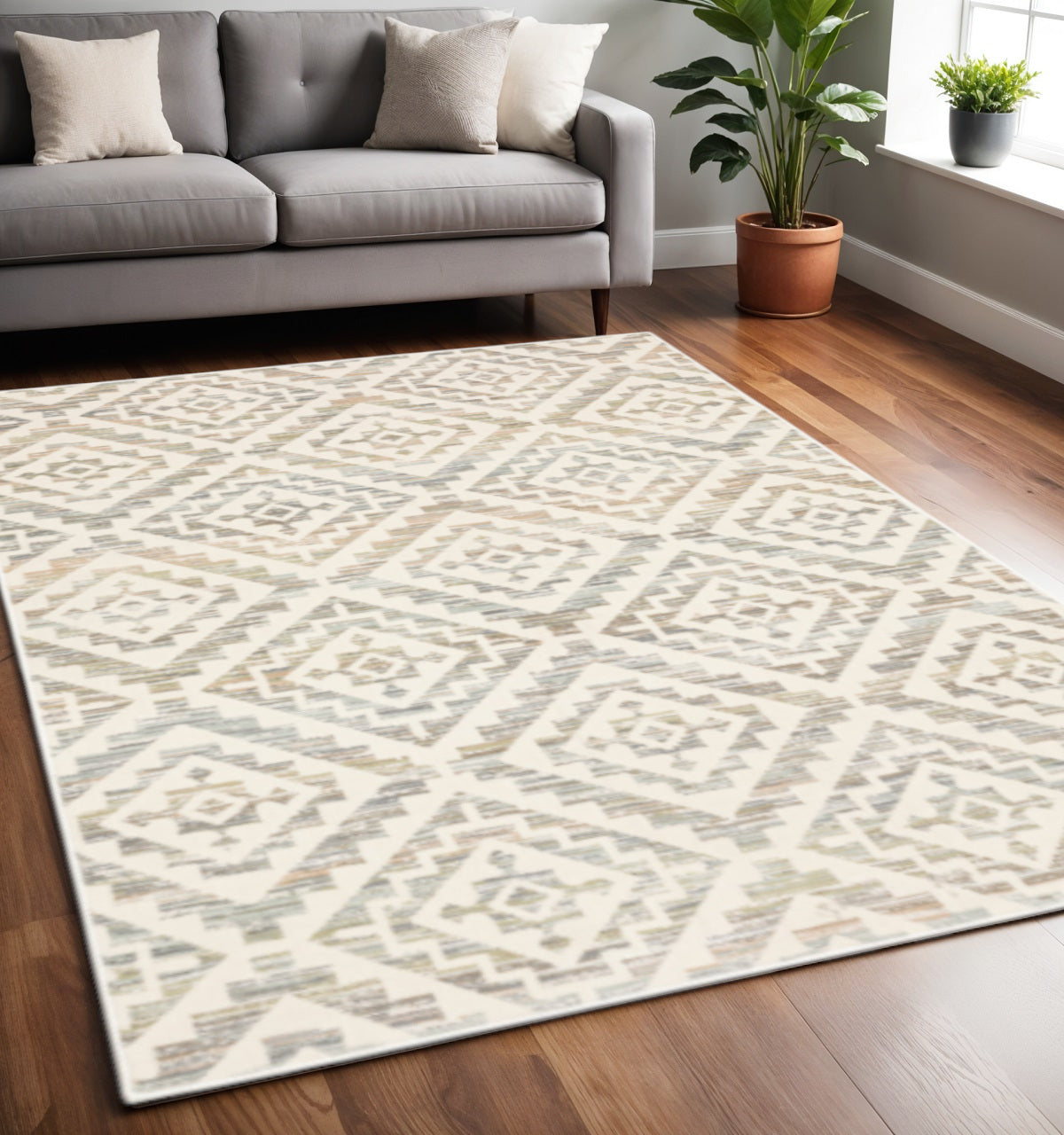 4' X 6' Grey Pink And Sage Geometric Power Loom Stain Resistant Area Rug