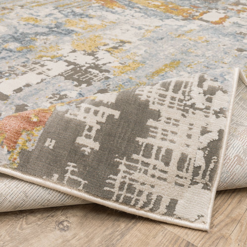 5' X 8' Grey Blue Beige Gold And Rust Abstract Power Loom Stain Resistant Area Rug