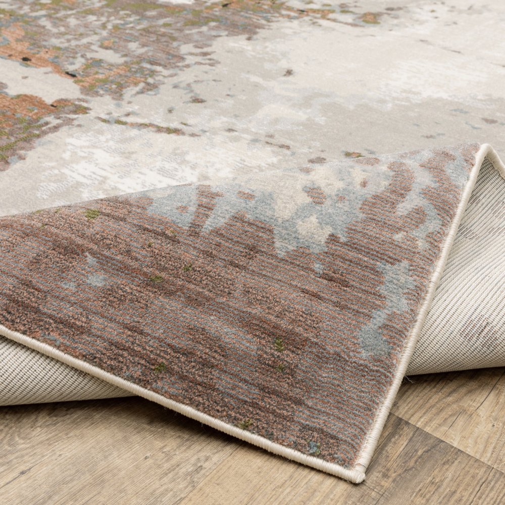 8' X 11' Beige And Pink Abstract Distressed Area Rug