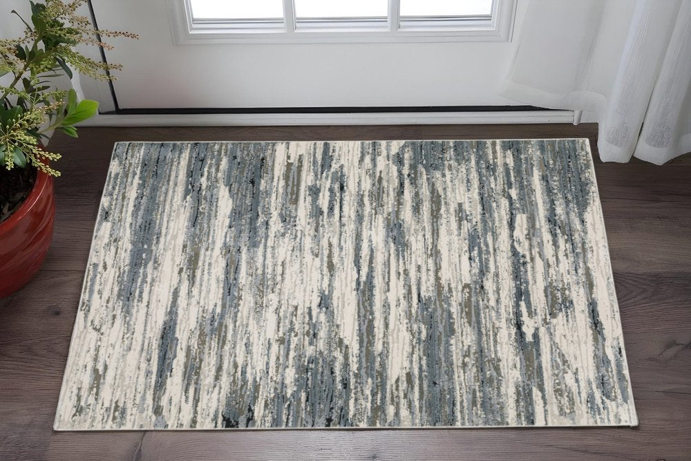 3' X 5' Blue Grey Beige And Brown Abstract Power Loom Stain Resistant Area Rug