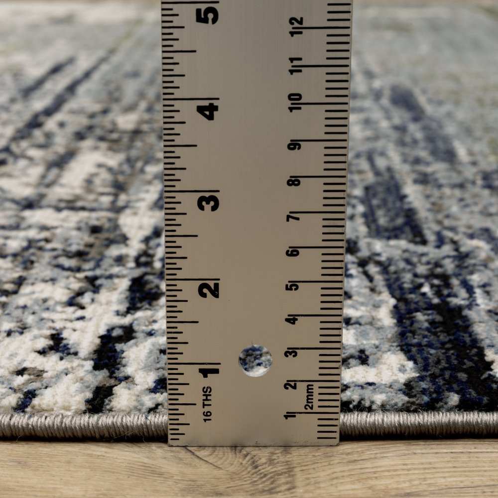 5' X 8' Gold Brown Rust Grey Blue And Beige Abstract Power Loom Stain Resistant Area Rug