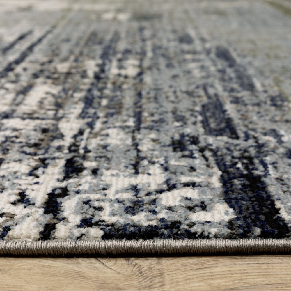 5' X 8' Gold Brown Rust Grey Blue And Beige Abstract Power Loom Stain Resistant Area Rug