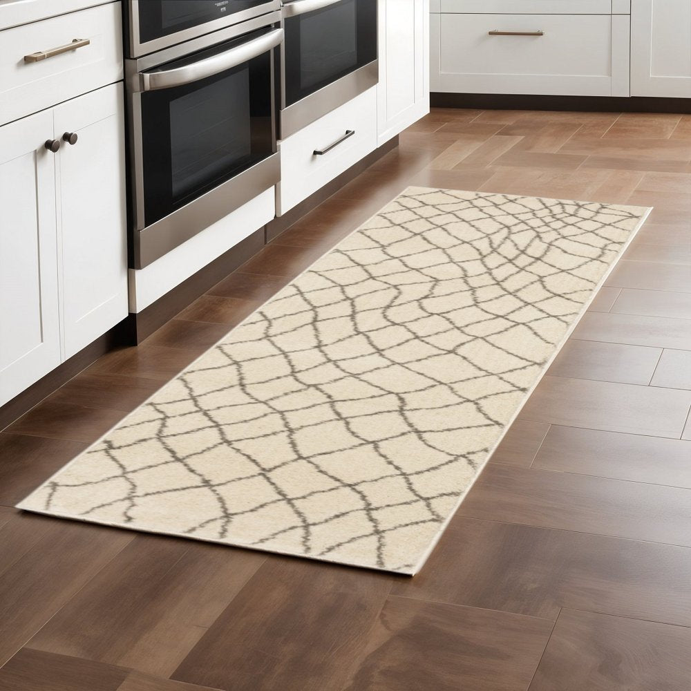 5' X 7' Ivory And Grey Geometric Power Loom Stain Resistant Area Rug