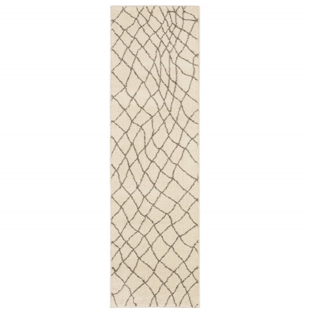 5' X 7' Ivory And Grey Geometric Power Loom Stain Resistant Area Rug
