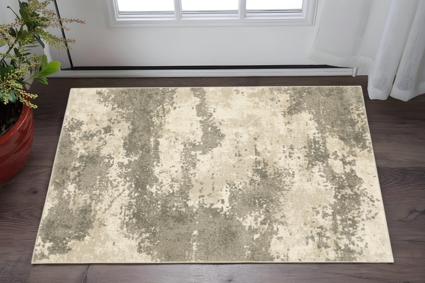 5' X 7' Beige And Grey Abstract Power Loom Stain Resistant Area Rug
