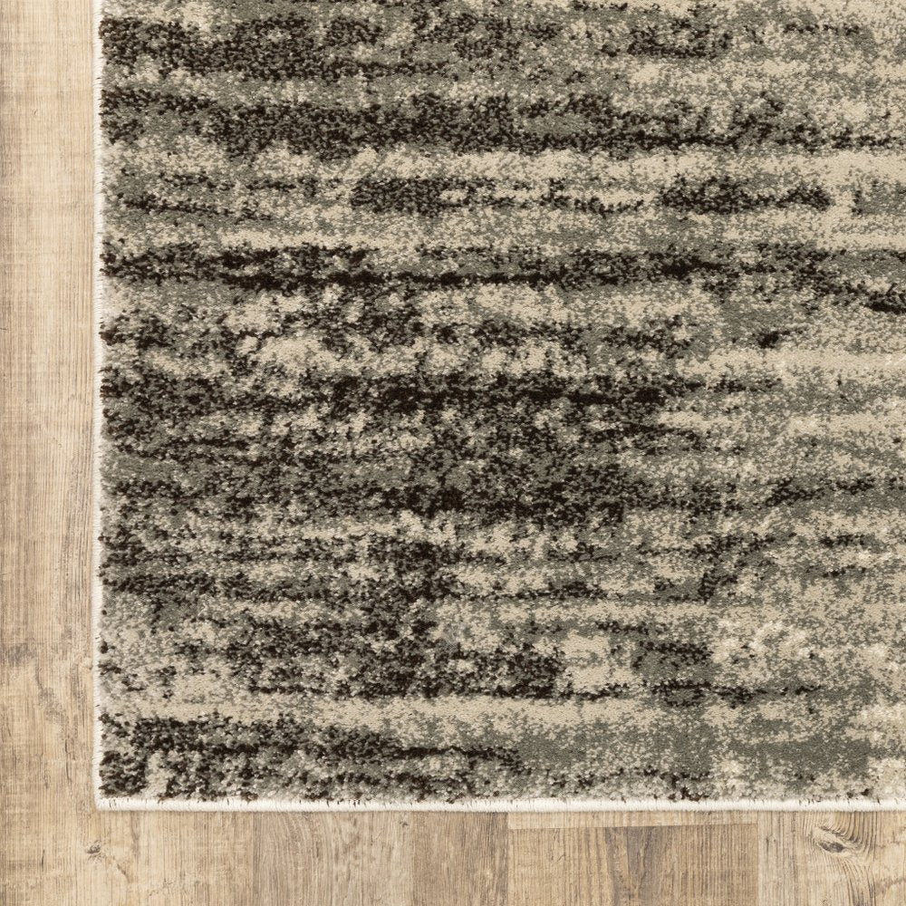 5' X 7' Beige And Grey Abstract Power Loom Stain Resistant Area Rug