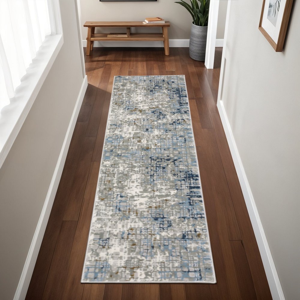 5' X 8' Blue Ivory Grey Brown Beige And Light Blue Abstract Power Loom Stain Resistant Area Rug