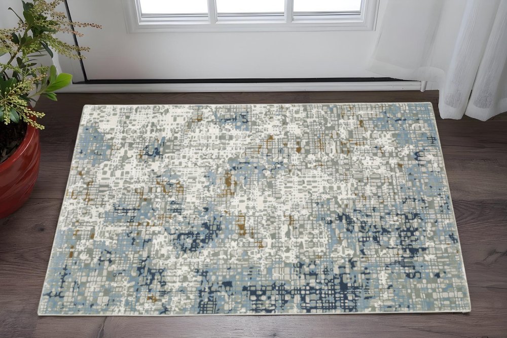 5' X 8' Blue Ivory Grey Brown Beige And Light Blue Abstract Power Loom Stain Resistant Area Rug