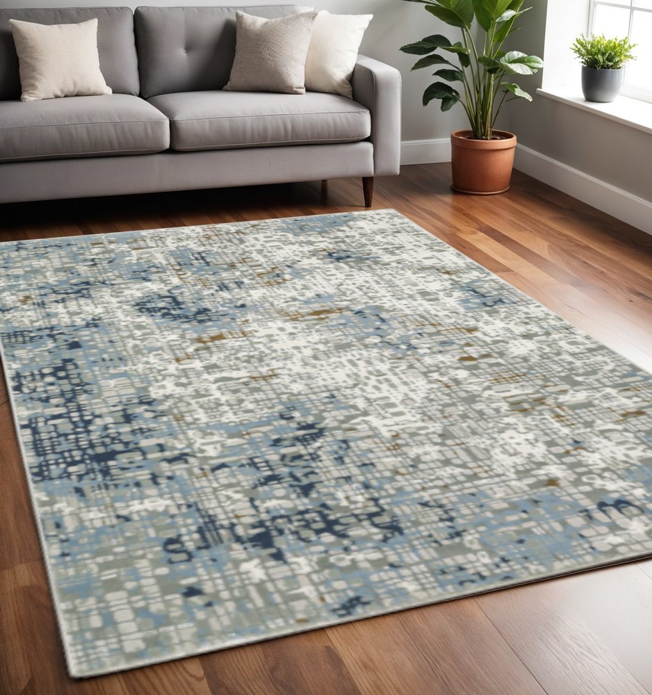 5' X 8' Blue Ivory Grey Brown Beige And Light Blue Abstract Power Loom Stain Resistant Area Rug