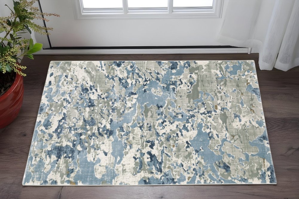 5' X 8' Grey Blue Ivory Navy Beige And Brown Abstract Power Loom Stain Resistant Area Rug