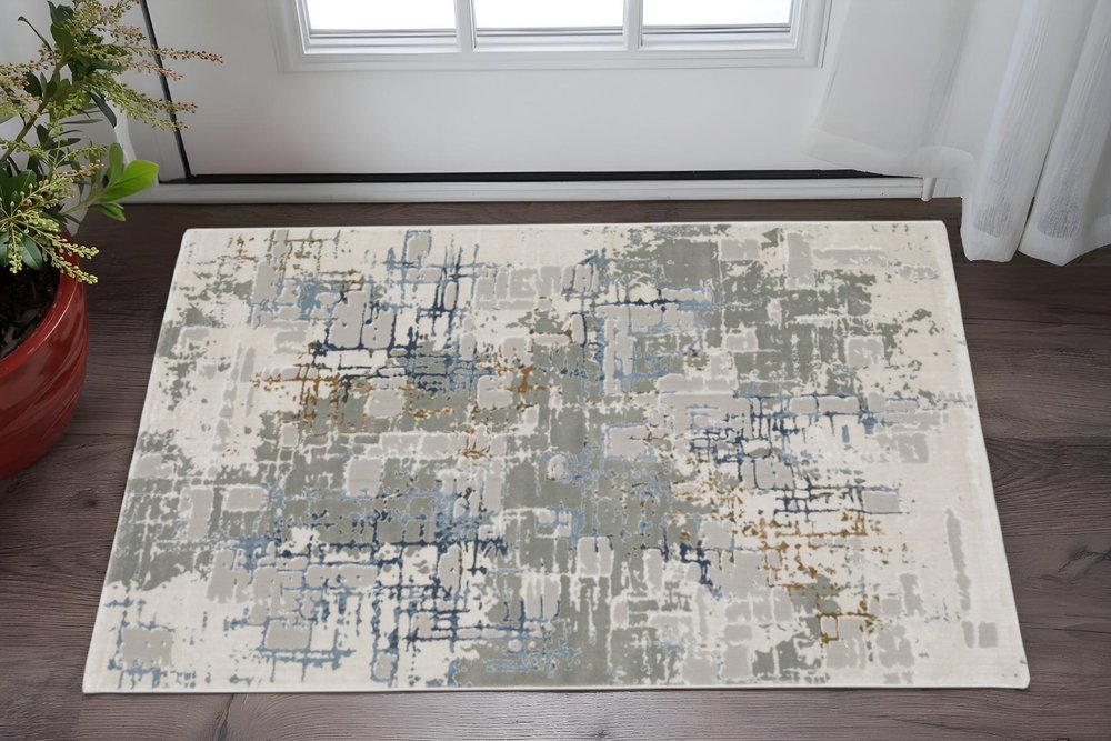 10' X 13' Grey Blue Brown Ivory And Deep Blue Abstract Power Loom Stain Resistant Area Rug