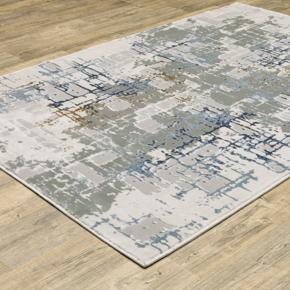 10' X 13' Grey Blue Brown Ivory And Deep Blue Abstract Power Loom Stain Resistant Area Rug