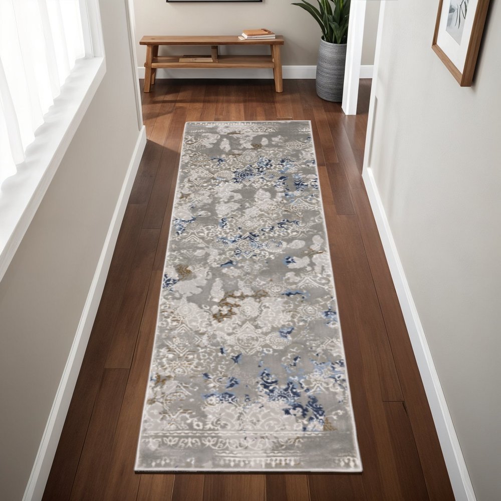 5' X 8' Grey Blue Ivory Brown And Navy Abstract Power Loom Stain Resistant Area Rug