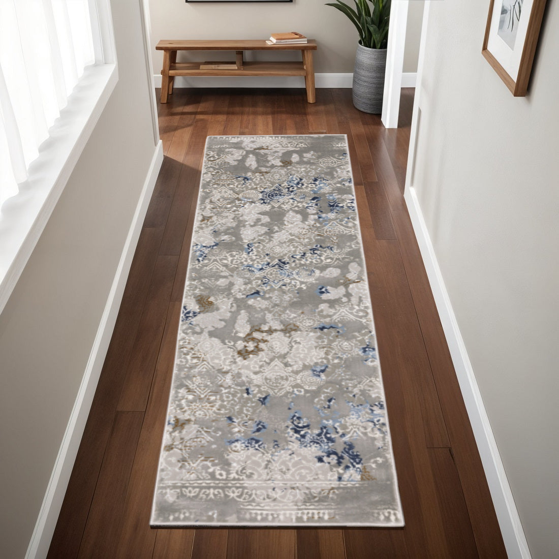 5' X 8' Grey Blue Ivory Brown And Navy Abstract Power Loom Stain Resistant Area Rug