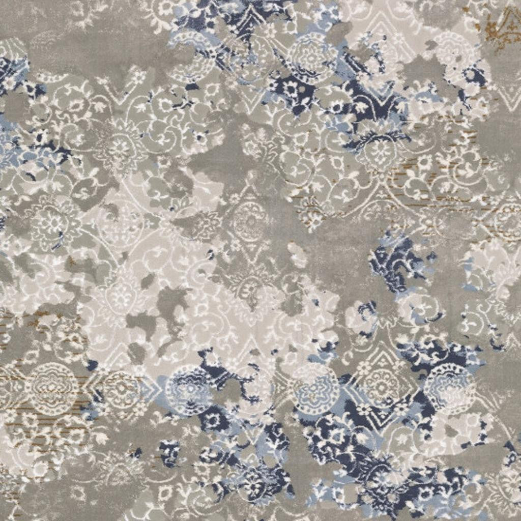 5' X 8' Grey Blue Ivory Brown And Navy Abstract Power Loom Stain Resistant Area Rug