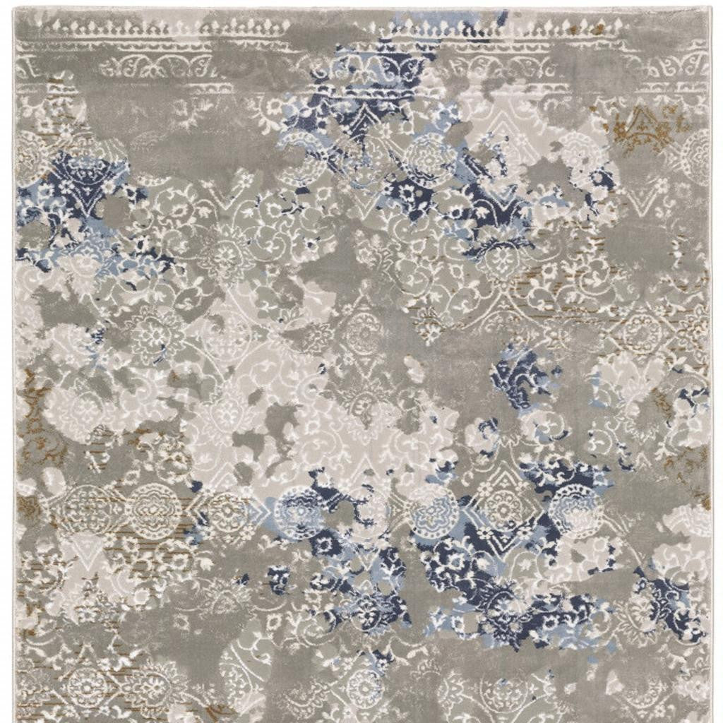 5' X 8' Grey Blue Ivory Brown And Navy Abstract Power Loom Stain Resistant Area Rug