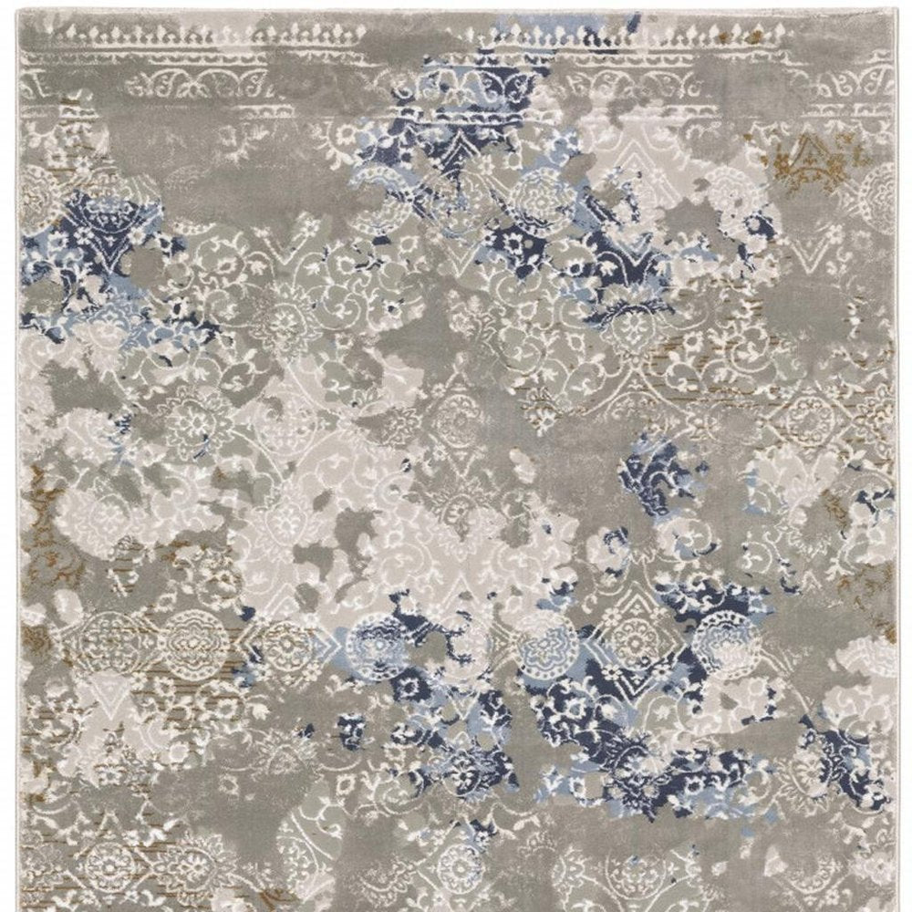 5' X 8' Grey Blue Ivory Brown And Navy Abstract Power Loom Stain Resistant Area Rug