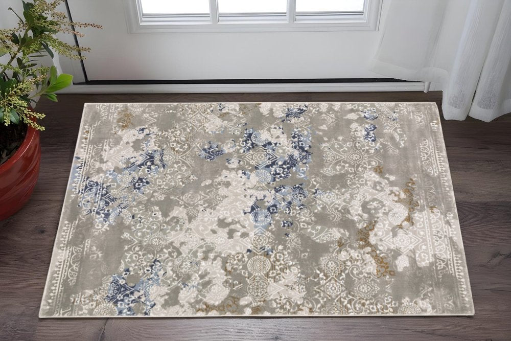 5' X 8' Grey Blue Ivory Brown And Navy Abstract Power Loom Stain Resistant Area Rug