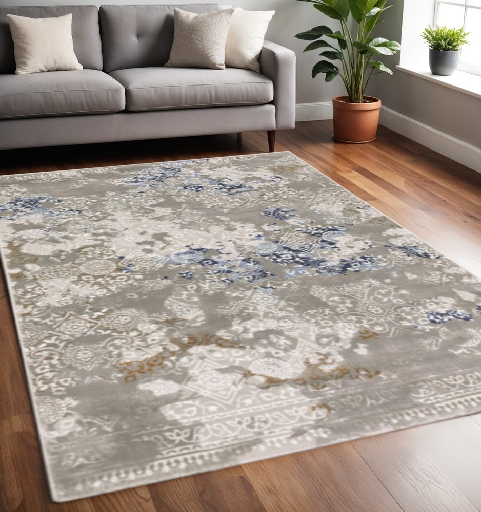 5' X 8' Grey Blue Ivory Brown And Navy Abstract Power Loom Stain Resistant Area Rug