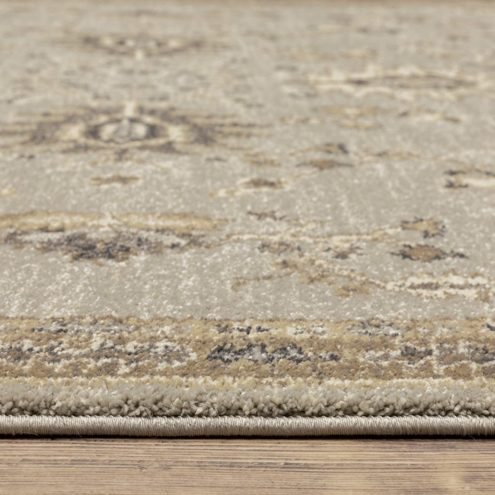 6' X 9' Grey Brown Tan And Beige Oriental Power Loom Stain Resistant Area Rug
